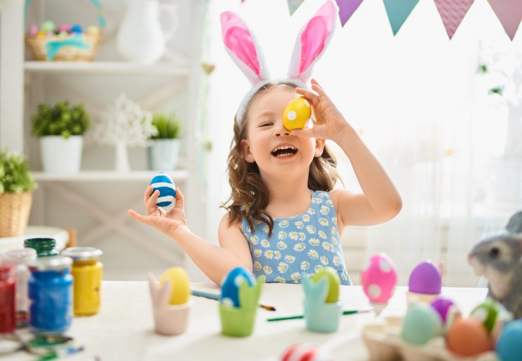 child painting eggs